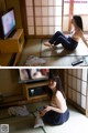 A woman sitting on the floor in front of a television.